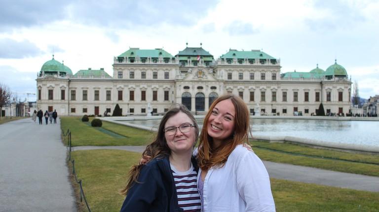 Two students pose in front of the Belvedere Museum buidling in Vienna, Austria